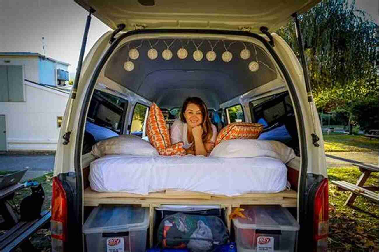 A Picture Of A Cozy Van Interior With A Comfortable Bed, A Small Kitchen, And Storage Space Your First Year On The Road: Tips For You Your Van And Having The Adventure Of Your Dreams (Van Life)