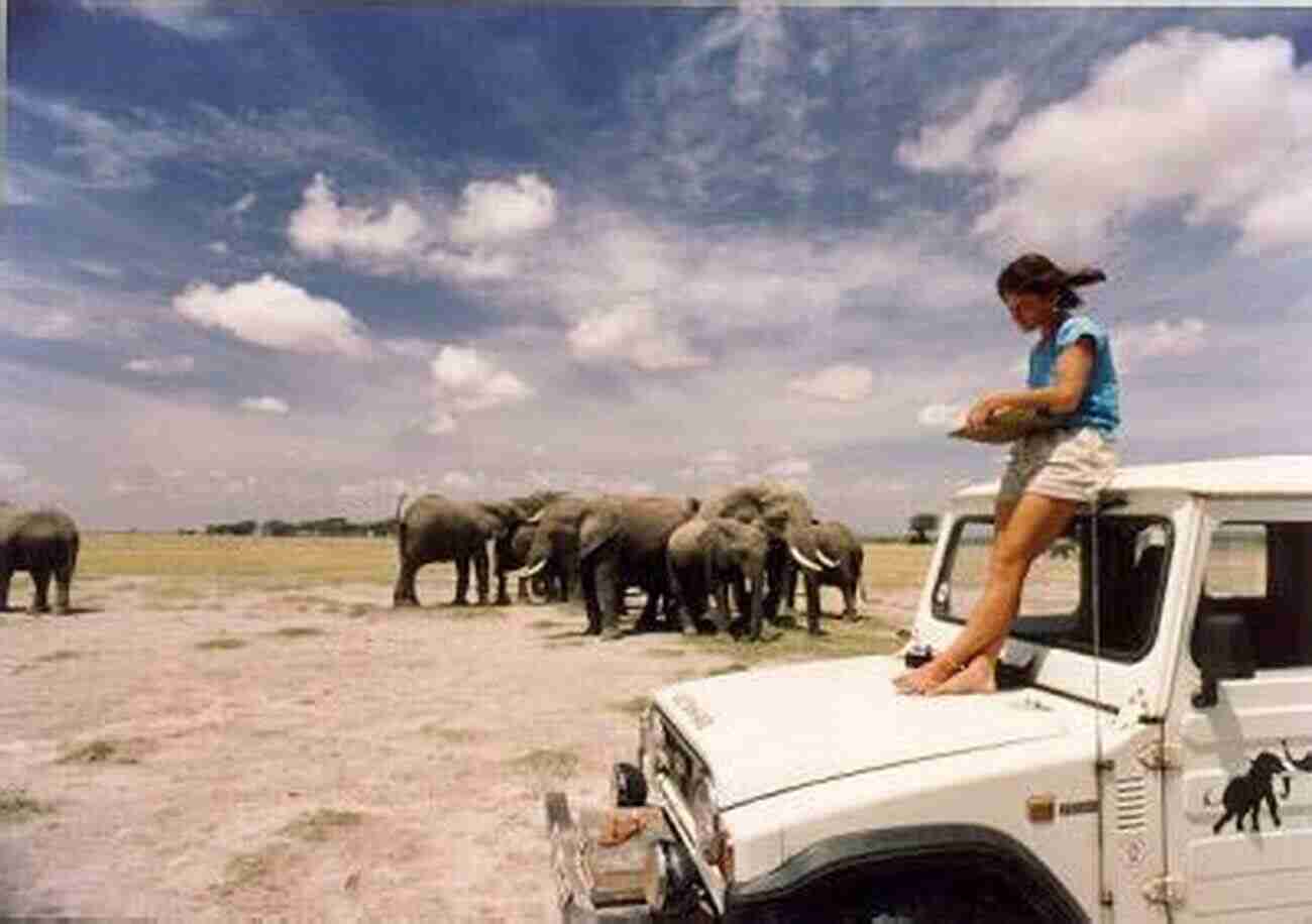 A Team Of Researchers Tracking Elephant Herds In A National Park Wildlife And Natural Resource Management