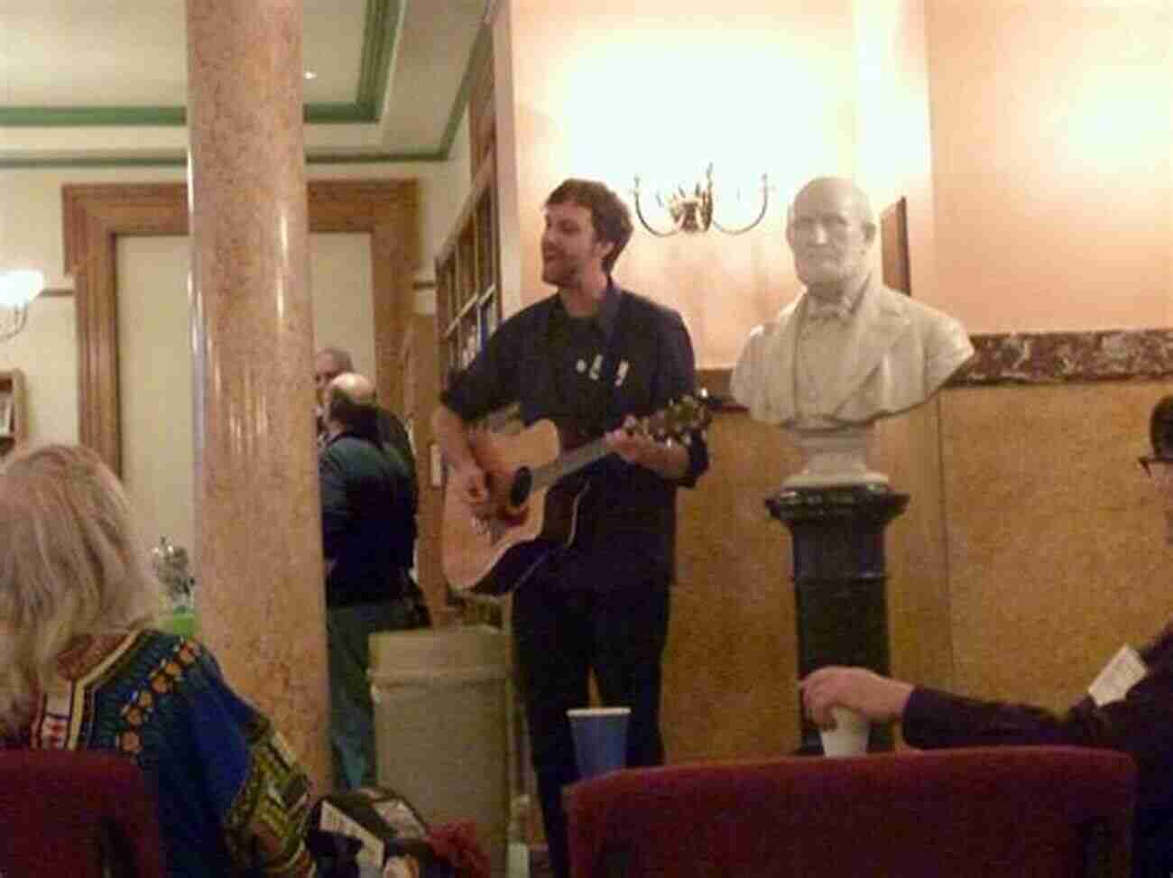 Busker Rouse Performing With His Guitar In Front Of A Mesmerized Crowd Busker D B Rouse