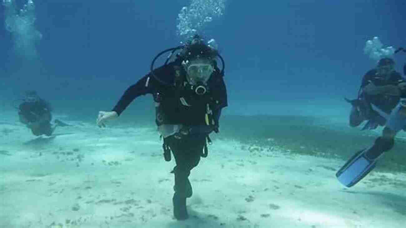 Diveheart Adaptive Scuba Instructor And Dive Buddy Taking Part In A Scuba Diving Session In A Beautiful Underwater Environment Diveheart Adaptive Scuba Instructor And Dive Buddy