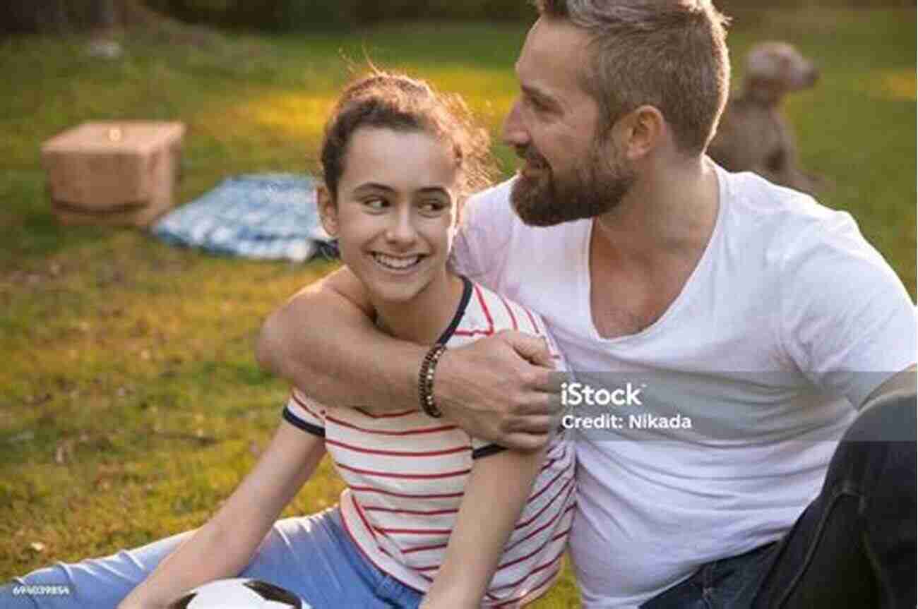 Father And Daughter Embracing In A Park FATHERS RAISING DAUGHTERS AFTER THE LOSS OF A SPOUSE