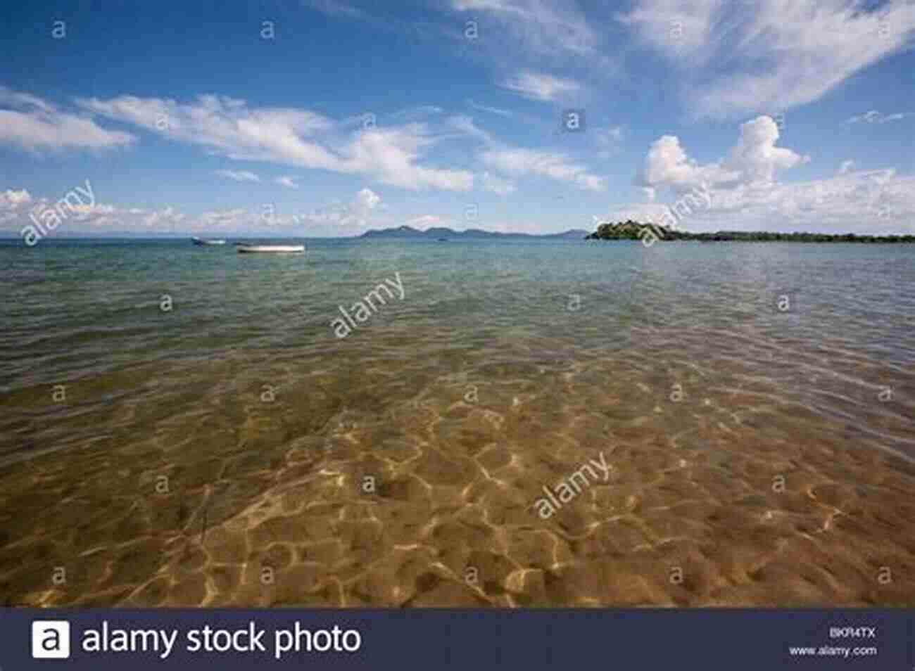 Lake Malawi A Mesmerizing View Of The Crystal Clear Waters Reflecting The Bright Blue Sky Malawi Travel Guide: With 100 Landscape Photos