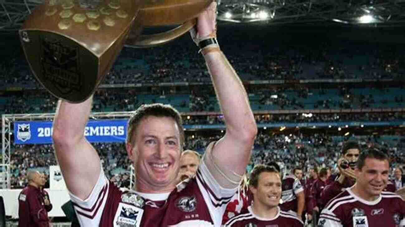 Steve Menzies Lifting The Trophy After Winning A Championship Game Beaver: The Steve Menzies Story